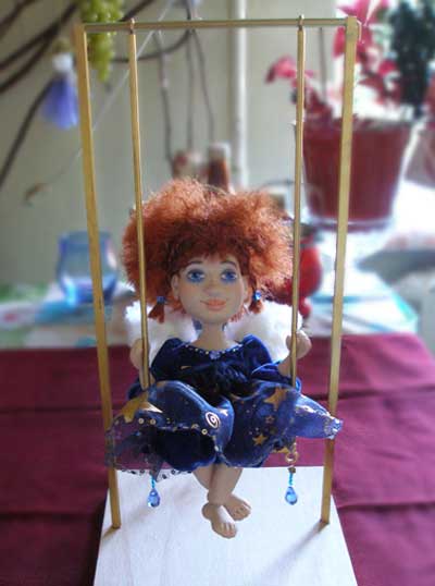 Red-haired Angel on swing